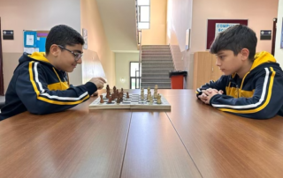 Two students from myp2 testing their chess skills against each other.
