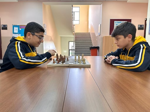 Two students from myp2 testing their chess skills against each other. 
